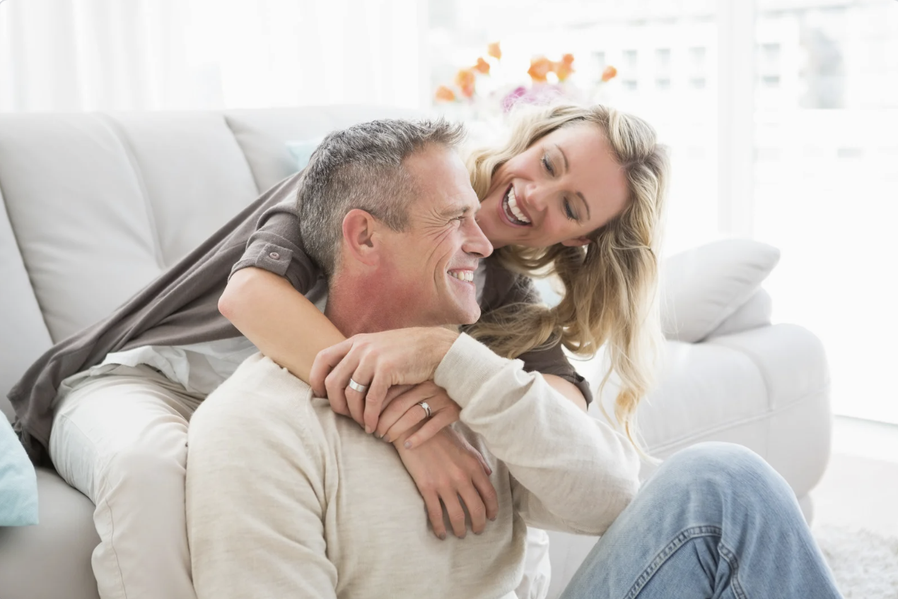 Happy_Couple_Cuddling How to Reprogram the Patterns Keeping You Stuck in Your Relationship